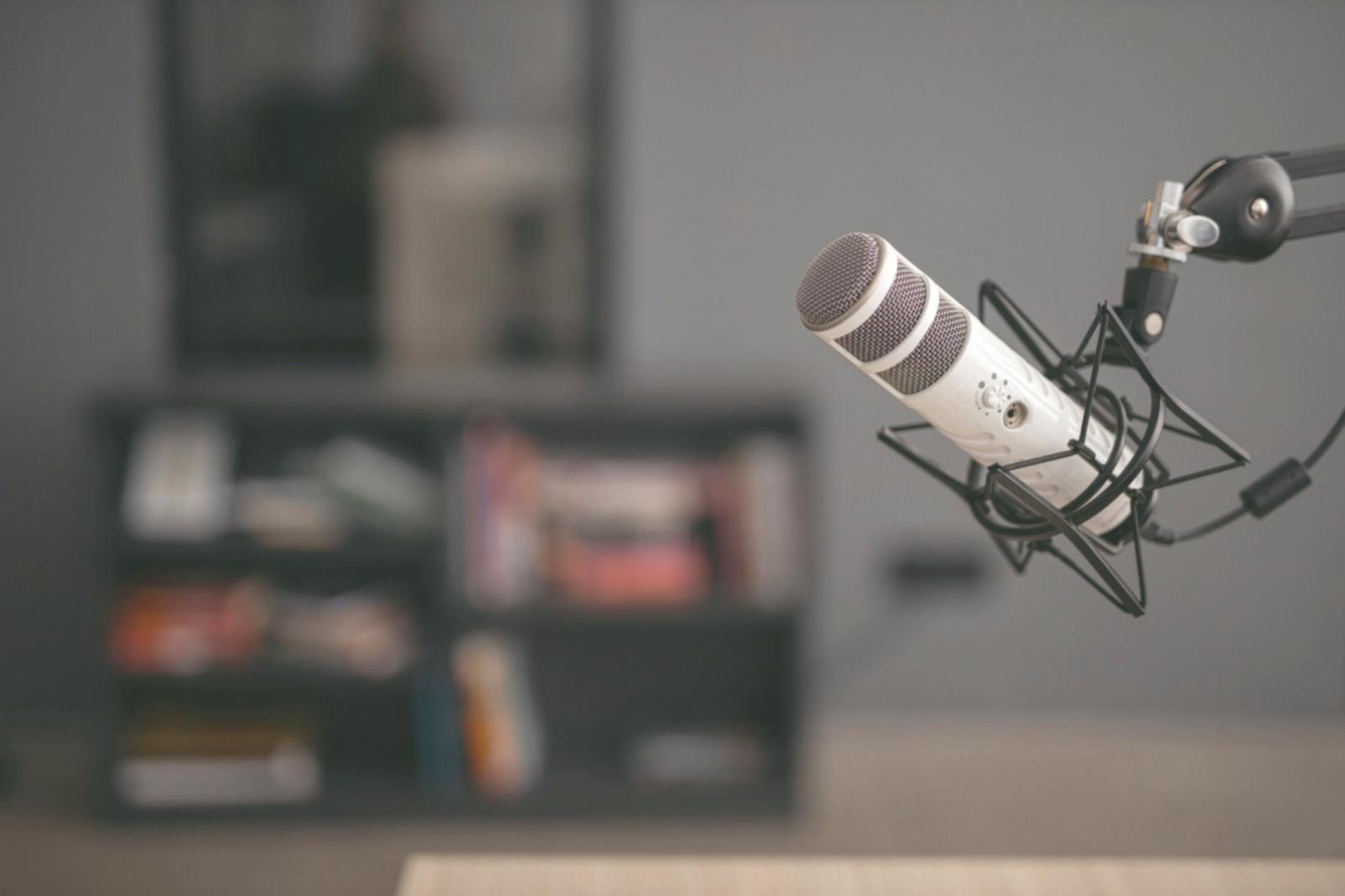 Journalist reviewing story angles in Malaysian newsroom environment