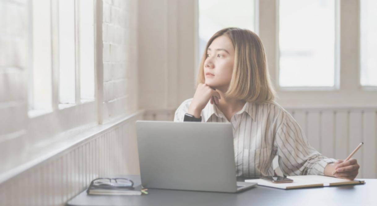 Journalist reviewing documents and notes at a desk